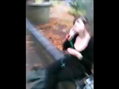 A dude is filming the cleavage of a sexy gal