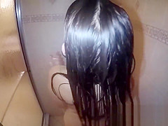 Amateur pornstar washing hair and body in the shower while you watch