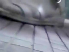 Asian girl rubs pussy on the toilet stall