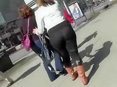 Big butt woman walks the city streets in spandex