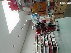 Blonde MILF in tight jeans pants at supermarket