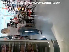 Blonde MILF in tight jeans pants at supermarket