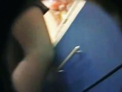 Blonde hussy lets a peek up her skirt