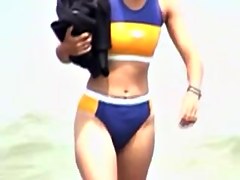 Candid bikini is worn by the amateur fem on the beach 07o