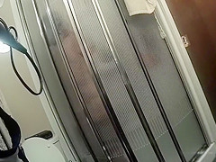Chubby maid with saggy tits takes a quick shower
