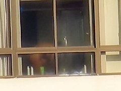 Ebony spied through her apartment window