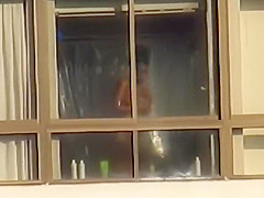 Ebony spied through her apartment window