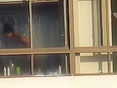 Ebony spied through her apartment window