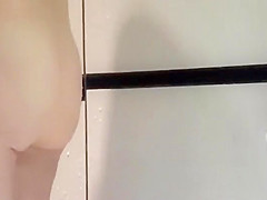 Girl with a hairy pussy showering off