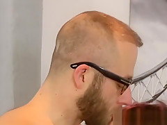Hunky gay in glasses fucks his younger redhead twink lover