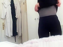 Mature woman changing in bathroom
