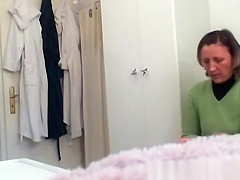 Mature woman changing in bathroom
