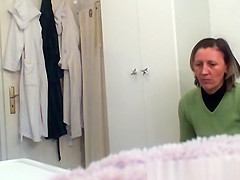 Mature woman changing in bathroom