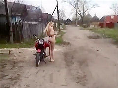 Naked on a motorbike