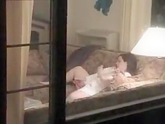 Peeping on a neighbor with a dildo