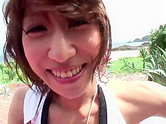 Randy brunette sucks guy's pole on the beach