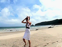 Randy brunette sucks guy's pole on the beach