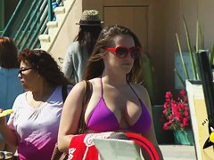 Street candid of a sexy girl in a tight purple bikini top