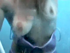 Tan lined chick uncovering her body in beach cabin