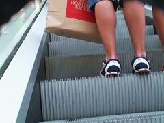 Tight skirts in the middle of the crowd in a shop