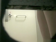 Woman in shower cabin washing her tight body