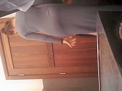 Woman lifts her long dress and takes a leak