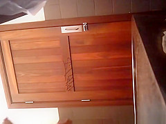 Woman lifts her long dress and takes a leak