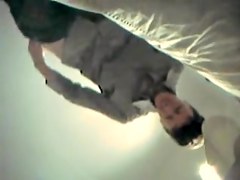 amateur taking off jeans in the changing room