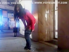 cutie pissing on a public sidewalk