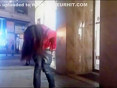 cutie pissing on a public sidewalk