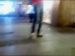 cutie pissing on a public sidewalk