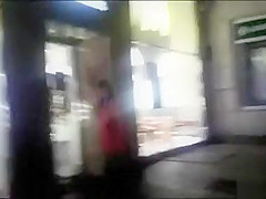 cutie pissing on a public sidewalk