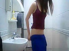teen 18+ seats in toilet to take a pee