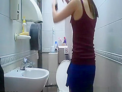 teen 18+ seats in toilet to take a pee