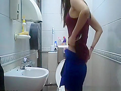 teen 18+ seats in toilet to take a pee