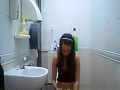 teen 18+ seats in toilet to take a pee