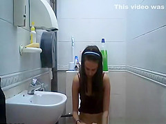 teen 18+ seats in toilet to take a pee